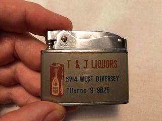 T & J Liquors Vintage Rolex Advertising Cigarette Lighter,  Chicago,  Ill.