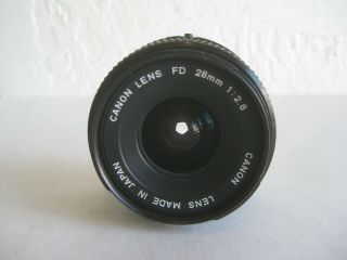 Vtg CANON FD 28MM 1:2.  8 CAMERA LENS MADE IN JAPAN w/CAPS 2