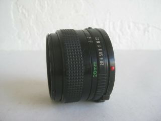 Vtg CANON FD 28MM 1:2.  8 CAMERA LENS MADE IN JAPAN w/CAPS 3