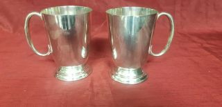 A Elegant Vintage Matching Silver Plated Tankards By Harrison Brs.