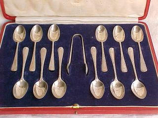 Boxed Set Of 12 Solid Silver Teaspoons And Tongs.  London 1924.