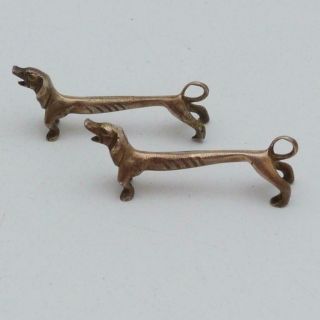 THREE VINTAGE METAL NOVELTY KNIFE RESTS IN THE FORM OF DACHSHUNDS 2