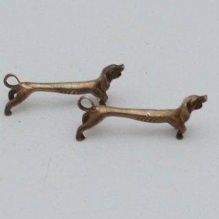 THREE VINTAGE METAL NOVELTY KNIFE RESTS IN THE FORM OF DACHSHUNDS 3