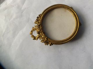 A Fine Antique Gilt Metal Oval Photo Frame With Easel Back