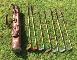 7 Antique Hickory Wood Shaft Golf Clubs And Vintage Stovepipe Leather Bag