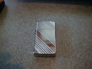 Old 1983 Slim Zippo Lighter Silver Tone Etch Looking Great