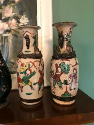 Pair Seal Marked Chinese Nanking Porcelain Crackle Glaze Warrior Motif Vases