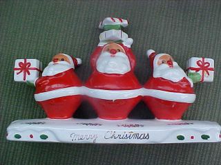 Vintage Santa Claus candle holder 3 Santas in a row with a base Merry Christmas 2
