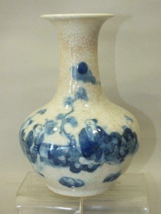 A Chinese Porcelain Vase With Blue Figures On A Crackle Glaze 19thc