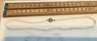 A Vintage Cultured Pearl Necklace With Rolled Gold Clasp