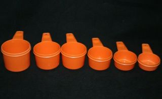 - Vintage Tupperware Set Of 6 Orange Measuring Cups