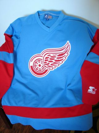 Vintage N.  H.  L.  Detroit Red Wings Hockey Jersey By Starter Alternate Color Lrg