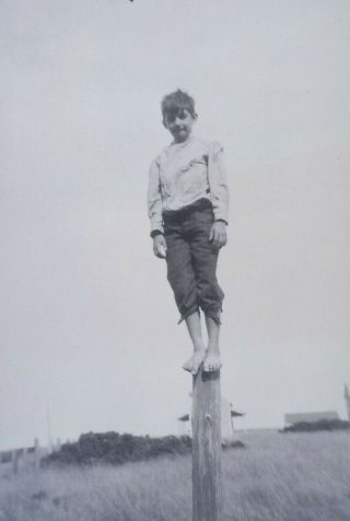 Vintage Photo Negative Film Boy Balancing On A Post