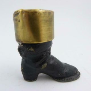 ANTIQUE CAST METAL AND BRASS MATCHHOLDER AND STRIKER IN THE FORM OF A BOOT 3