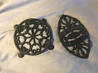 (2) Vintage Cast Iron Trivets 5 " Inches Round W/ Claw Feet,  Oval W/ Scroll Art