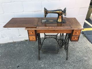 Antique 1910 Singer Treadle Sewing Machine With Oak Cabinet.  Decorated Red Eye