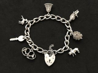 Vintage Sterling Silver Charm Bracelet With 7 Silver Charms.  34 Grams