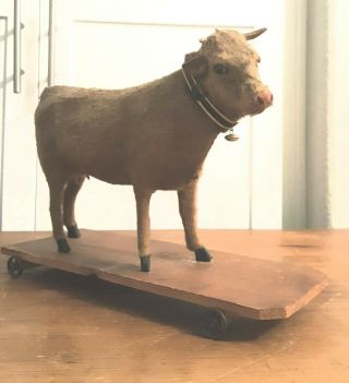 Antique Cow Pull Toy Platform On Wheels