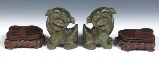 A Pair Antique Chinese Carved Green Jade Foo Dogs with Craved Rosewood Stands. 2
