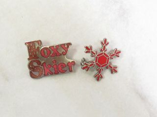 2 Vintage Ski Pins 1970s/80 Retro Foxy Skier & Red Snowflake Lapel Hat