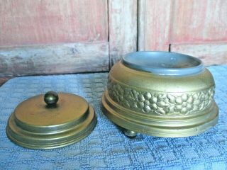 Vintage Tin gold tone Powder Puff Round Music Box with Legs and Lid dated 1942 2