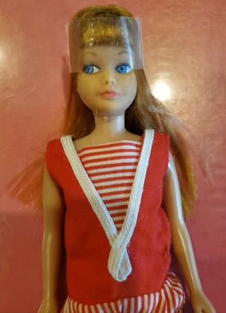 Vintage Barbie Red Titian Skipper Doll hair in plastic 2