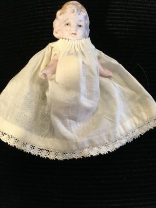 Antique German All Bisque Baby Doll With Articulated Limbs.