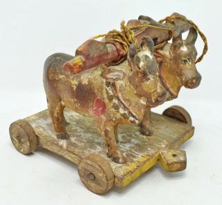 Antique Wooden Two Cows On Wheels Figurine Old Hard Wood Carved Painted