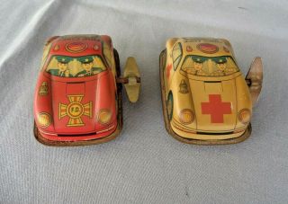 Two Vintage Tin Wind Up Toys Fire Chief And Ambulance
