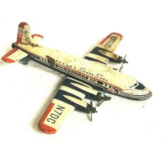 Vintage Douglas Dc - 7c Tin Toy Airplane Seven Seas
