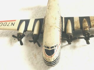 Vintage Douglas DC - 7C Tin Toy Airplane Seven Seas 2