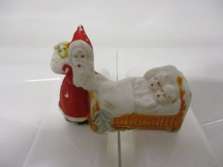 An Antique Bisque Cake Topper Christmas Decoration - Santa Delivering Gifts - German