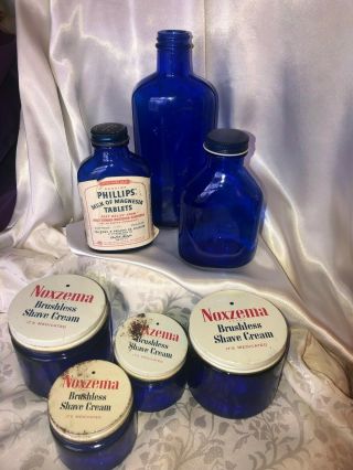 7 vtg cobalt blue glass:4 Noxzema jars,  3 bottles,  1 w/1961 Milk of Magnesia label 2