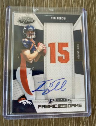 2010 Rookie Certified Fabric Of The Game 12 Tim Tebow 15/25 Denver Broncos