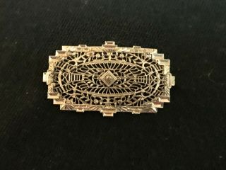 Antique Silver Pin With Filigree Design And Faux Diamond Center