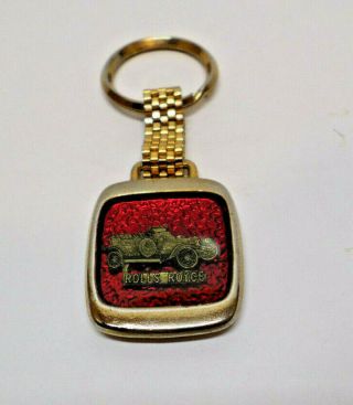 Vintage Rolls Royce Keychain Sparkling Red Back Ground Gold Tone 3 3/8 " X 1 1/4 "