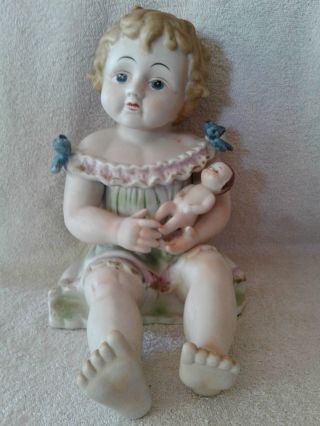 Antique German Conta Boehme Bisque Piano Baby Girl With Doll 12 " Tall 10.  5 " Long