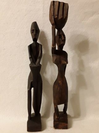 Vintage Hand Carved Wood African Figurines Of A Man & A Woman.