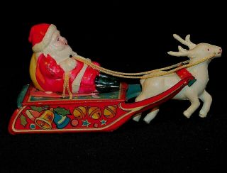 Vintage 5 " Plastic Or Celluloid Friction Toy Santa & Tin Sleigh With A Reindeer