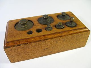 Antique Avoirdupois Weight Set Housed In A Solid Oak Block.