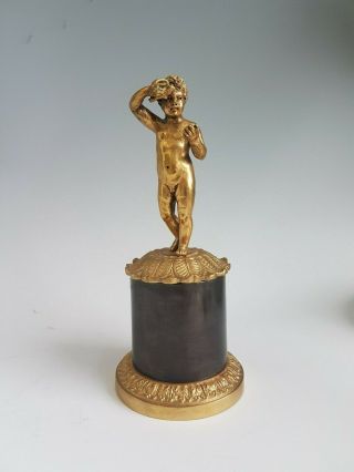Antique Gilt Bronze Figure Of A Boy Or Putti On Bronze Base.