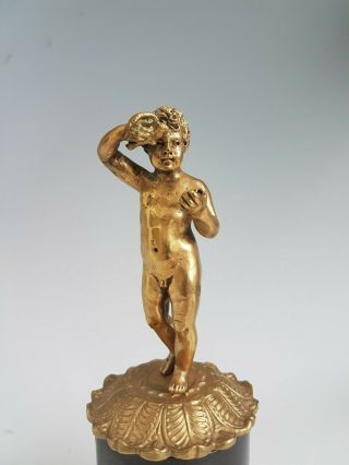 Antique Gilt Bronze Figure of a boy or Putti on bronze base. 2
