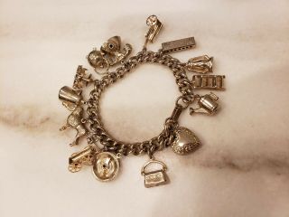Tons Of Charm Vintage 15 Charm Bracelet,  Gold Tone,