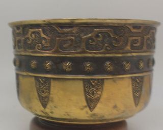 An Archaistic Chinese bronze bowl decorated in three bands 2