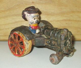 Vintage Cast Iron Porky Pig Driving Tractor Toy