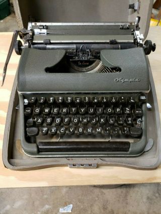 Vintage Olympia Deluxe Portable Typewriter (green)