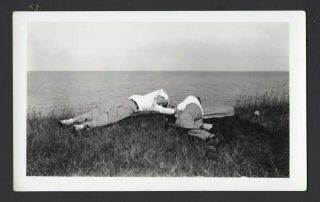 Two Men Resting At The Ocean On Overcast Day.  Unusual Vintage Snapshot.