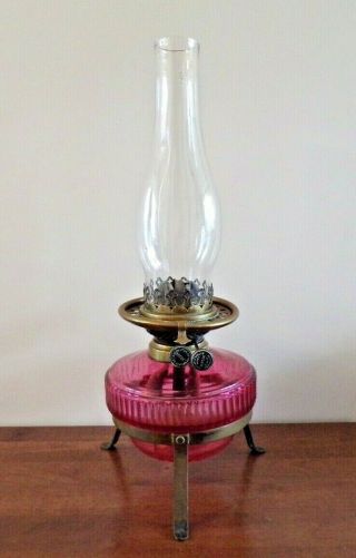 Victorian Wright Butler Oil Lamp With A Cranberry Glass Font On Stand