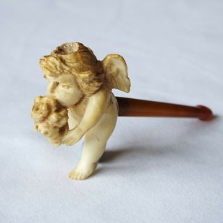 A Small,  Antique Meerschaum Pipe With Its Bowl Carved As A Winged Cherub