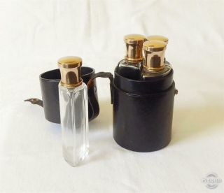Antique Leather Cased Travelling Set Of Four Shaped Bottles With Stoppers